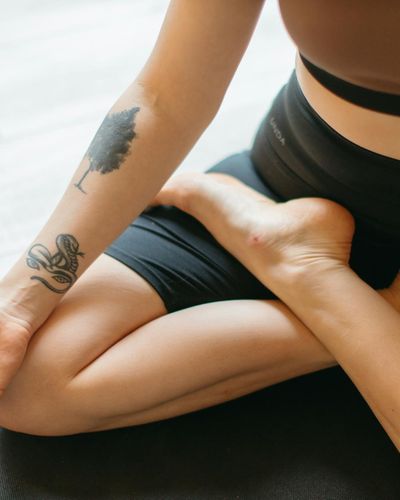 Close-up of a person's feet on a yoga mat, showing stability.